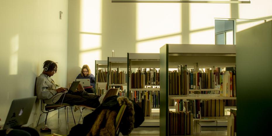 Two students studying in Charles Library